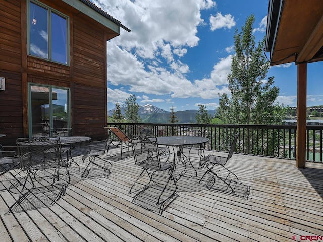 wooden deck featuring a mountain view