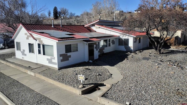 view of front of house with solar panels