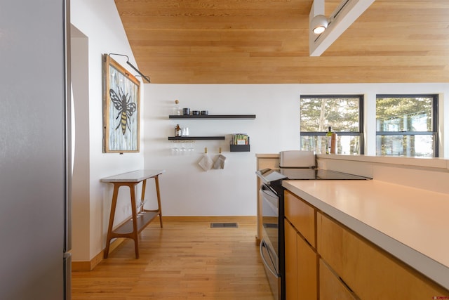 kitchen with wood ceiling, lofted ceiling, stainless steel electric range oven, and light hardwood / wood-style flooring