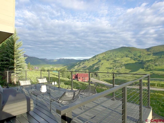 wooden terrace with a mountain view