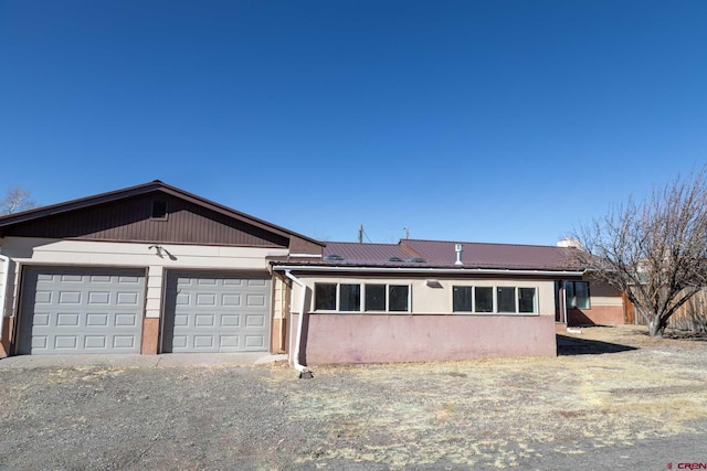 ranch-style house featuring a garage