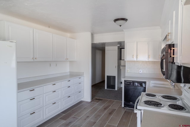 kitchen featuring sink, tasteful backsplash, ornamental molding, black appliances, and white cabinets