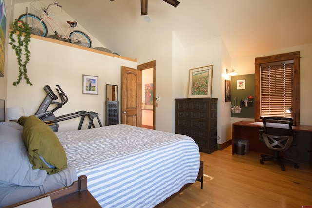 bedroom with high vaulted ceiling, ceiling fan, and light wood-type flooring