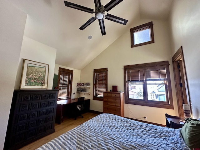 bedroom with hardwood / wood-style floors, high vaulted ceiling, and ceiling fan