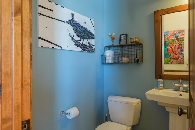 bathroom featuring sink and toilet