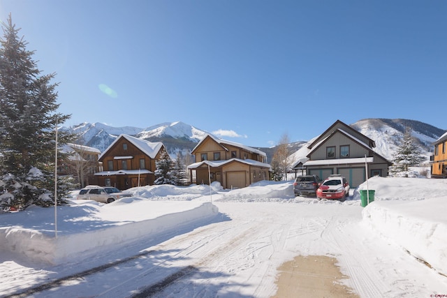 exterior space featuring a garage and a mountain view