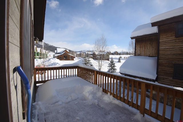 view of snow covered deck