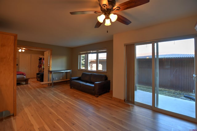 unfurnished living room with ceiling fan and light hardwood / wood-style floors