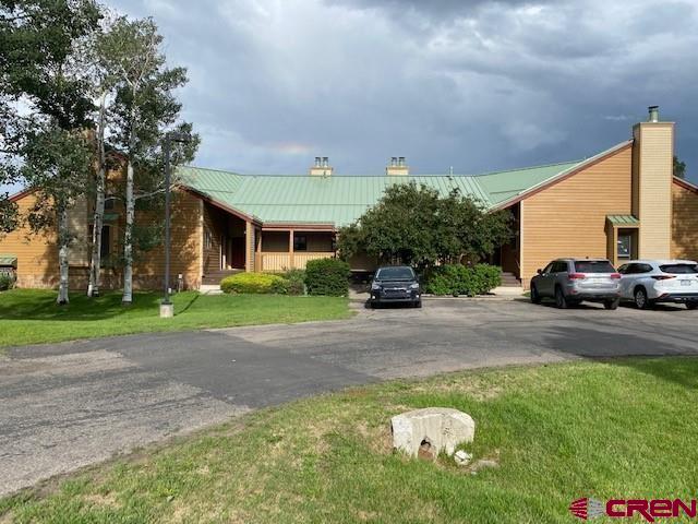 exterior space with a front lawn