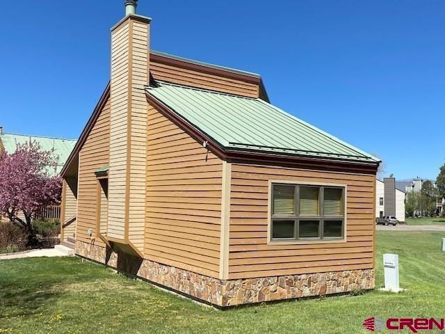 view of home's exterior featuring a yard