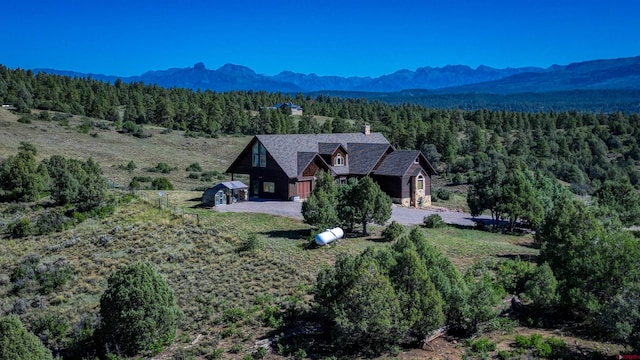 birds eye view of property with a mountain view