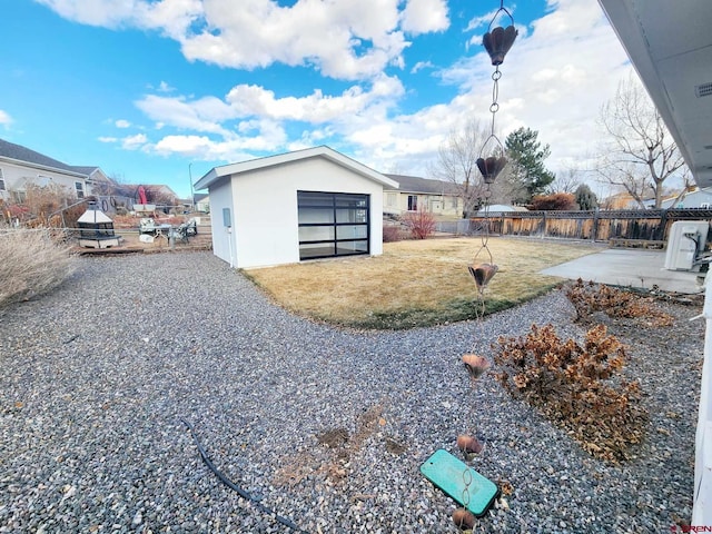 view of side of property with a patio and a yard