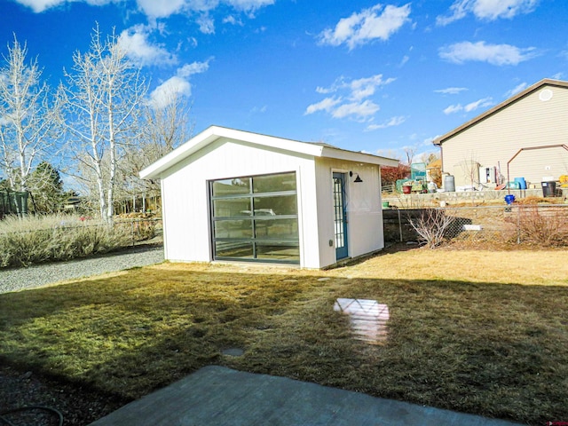 view of outdoor structure featuring a lawn