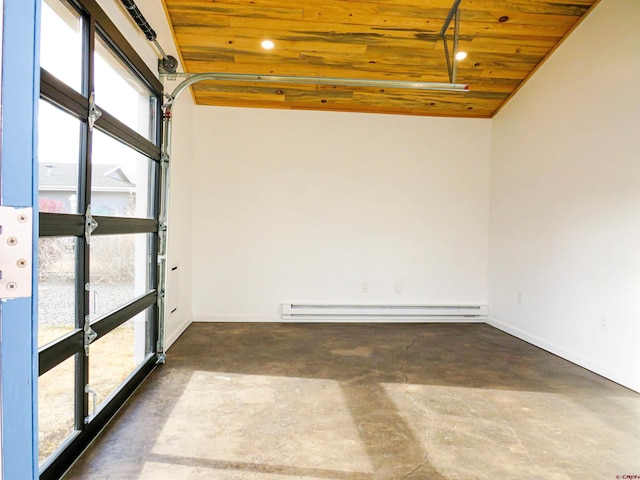 empty room featuring wooden ceiling and baseboard heating