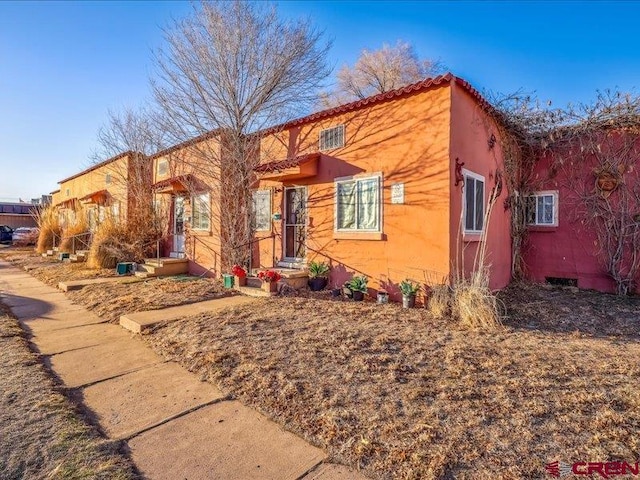 view of front of property featuring stucco siding