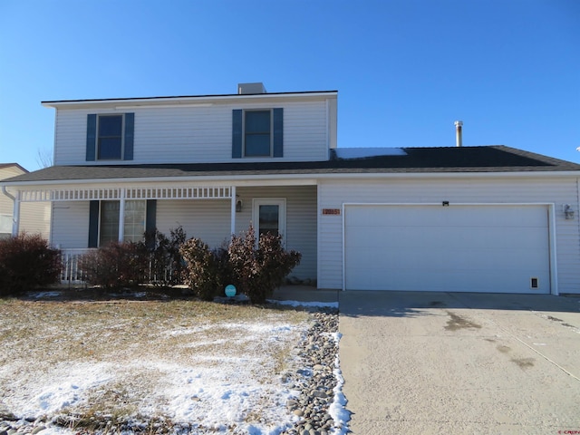 front facade with a garage and covered porch