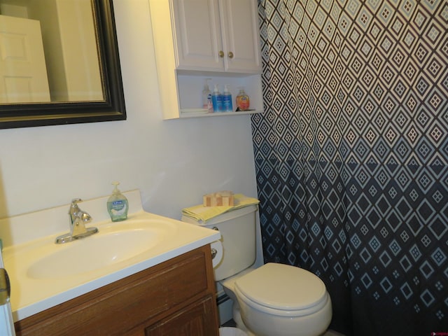 bathroom featuring vanity and toilet