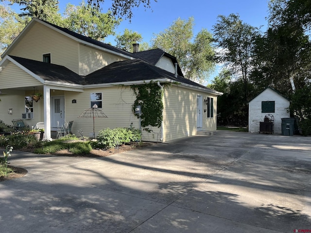 view of side of home with an outbuilding and cooling unit