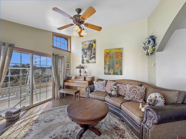 living room featuring ceiling fan and wood-type flooring