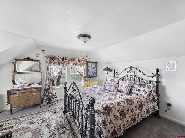 carpeted bedroom featuring vaulted ceiling