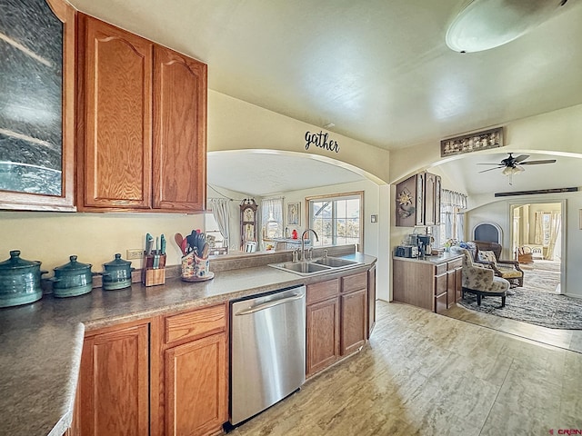 kitchen with dishwasher, sink, ceiling fan, and light hardwood / wood-style floors