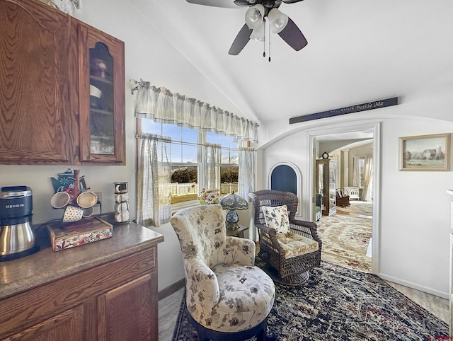 sitting room with vaulted ceiling and ceiling fan