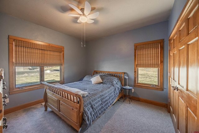 bedroom featuring ceiling fan and carpet