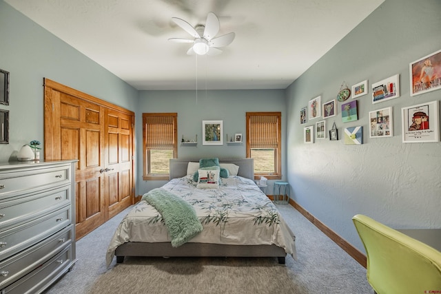 carpeted bedroom with ceiling fan