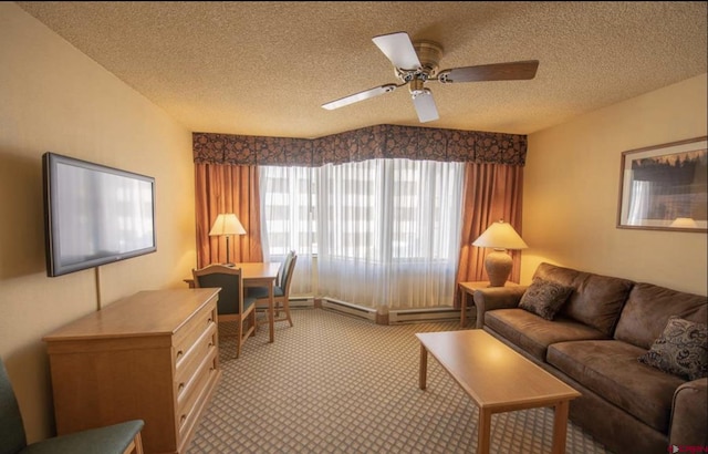 living room with ceiling fan, light colored carpet, and a textured ceiling