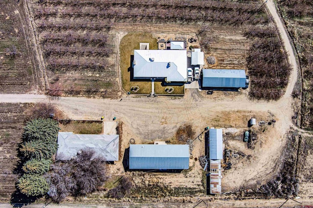 birds eye view of property featuring a rural view