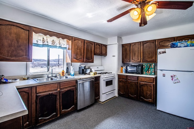 kitchen featuring sink, white appliances, dark brown cabinets, a textured ceiling, and ceiling fan