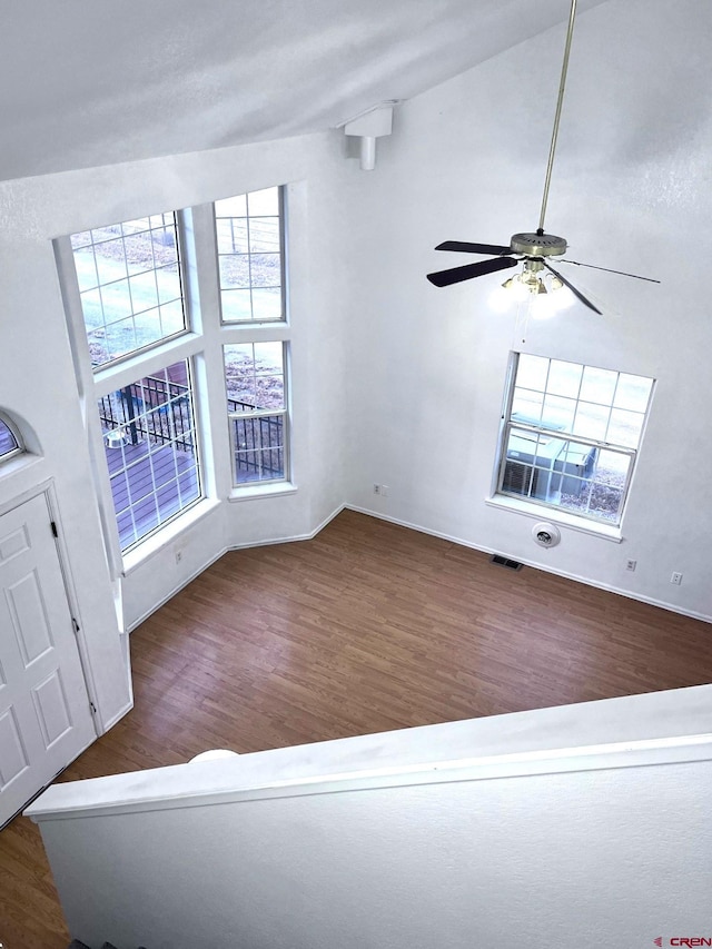 unfurnished living room featuring hardwood / wood-style flooring and ceiling fan