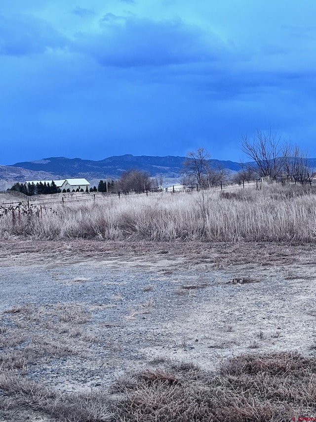 view of mountain feature with a rural view