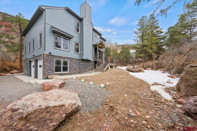 view of side of property with a garage