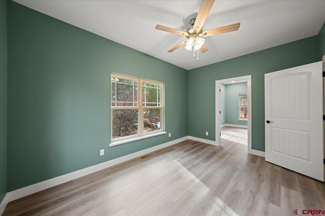 unfurnished bedroom with light hardwood / wood-style flooring and ceiling fan