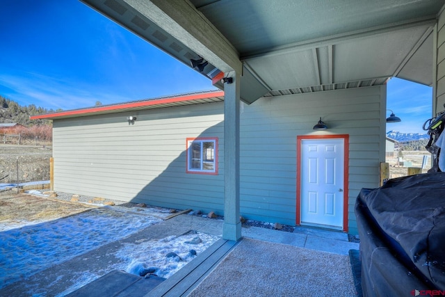 property entrance featuring a patio