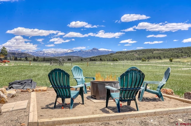 view of patio / terrace featuring a mountain view and a rural view