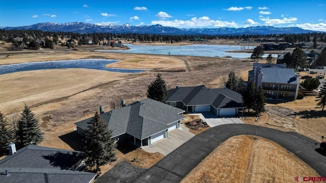 bird's eye view featuring a water and mountain view