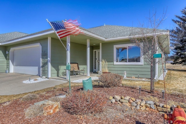 ranch-style house featuring a porch and a garage