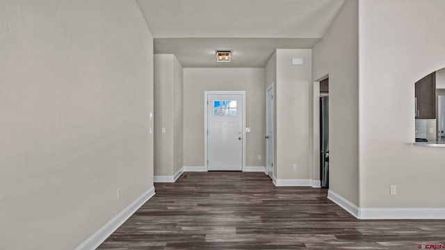 entryway with dark hardwood / wood-style flooring