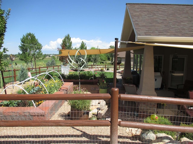 view of jungle gym with a rural view