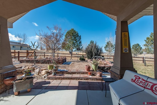 view of patio / terrace with a rural view