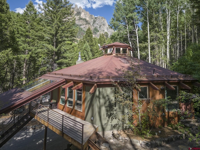 back of house with a mountain view