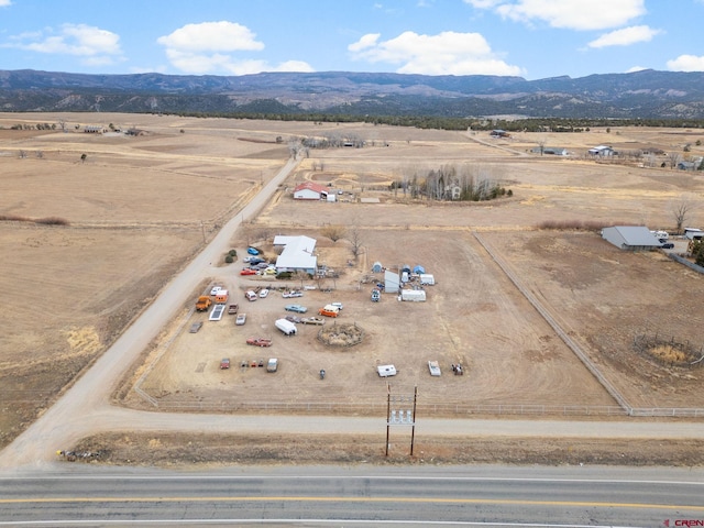 drone / aerial view with a mountain view and a rural view