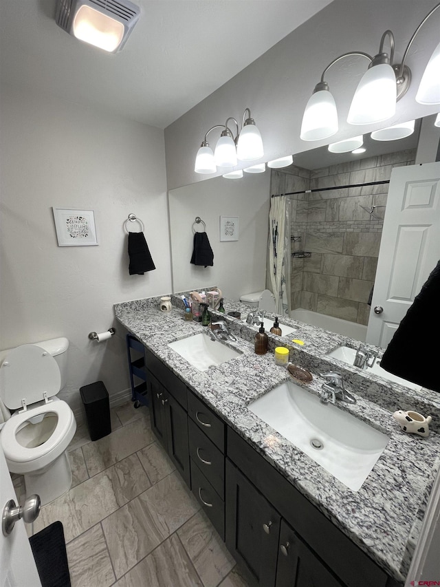 full bathroom featuring vanity, toilet, and shower / tub combo