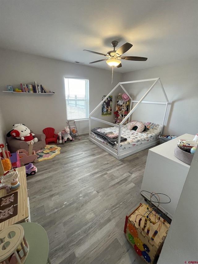 interior space featuring wood-type flooring and ceiling fan