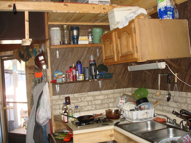 kitchen featuring light countertops and a sink