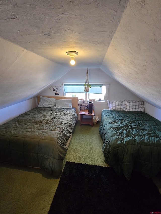 carpeted bedroom featuring vaulted ceiling and a textured ceiling