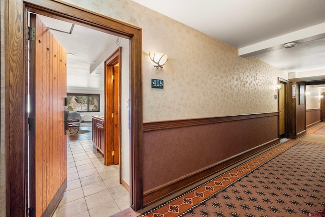 corridor featuring light tile patterned floors