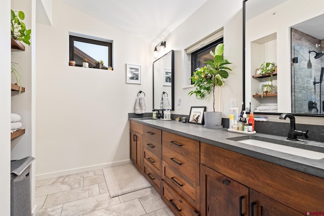 bathroom featuring vanity and a shower with door